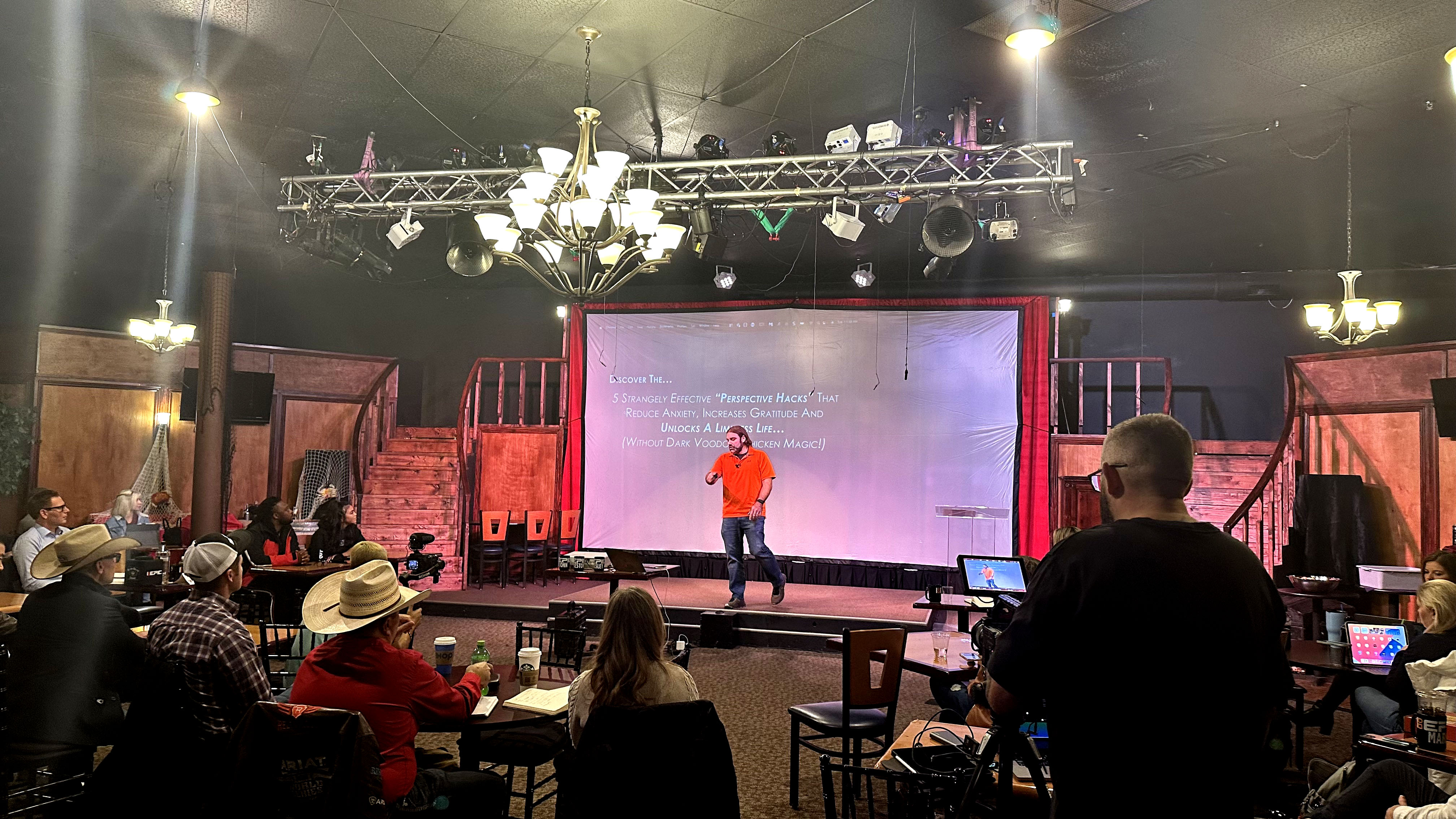 Josh Beechraft commanding the room during a live event speaking engagement