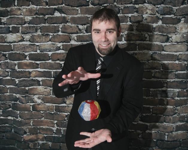 Josh Beechraft early in his career as a professional magician, studying attention and perception